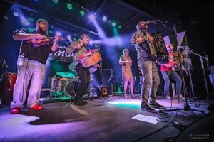 Image of Music group playing live music on stage